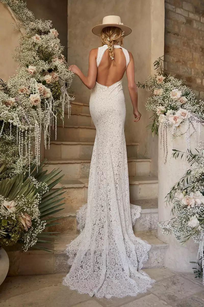 Lace mermaid silhouette wedding gown with low back opening