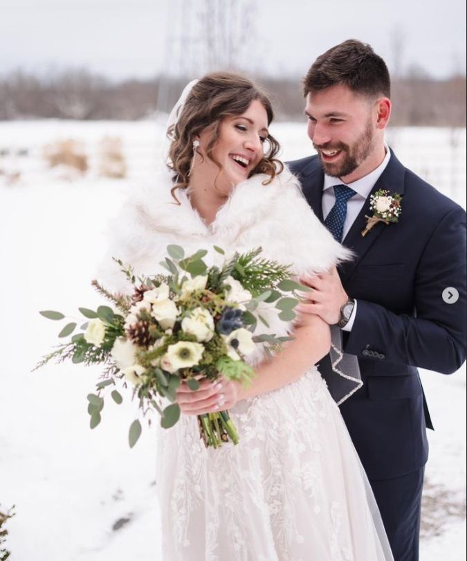 White anemones with pine cone winter bouquet