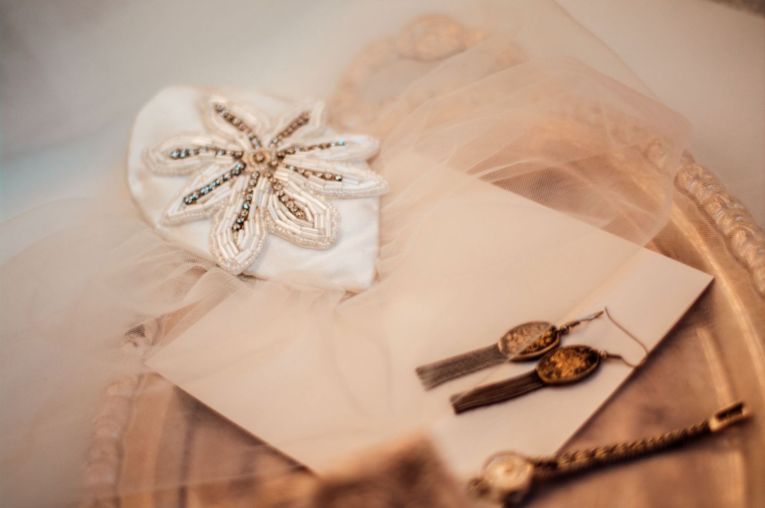 Teardrop shaped fascinator with birdcage veil